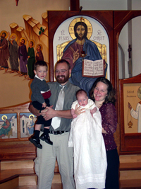 Одни из членов общины после крещения ребенка